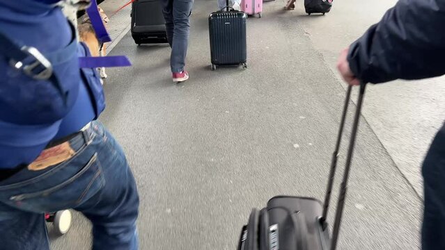train platform with busy travellers and luggage