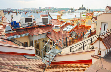 Top view at the roofs, chimneys, steps, heating systems. 
