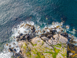 bird`  s eye view from a drone at the stony coastline on the lofoten norway - Powered by Adobe