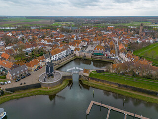 Fototapeta na wymiar An aerial drone photo of the town centre and old dutch mill in Heusden