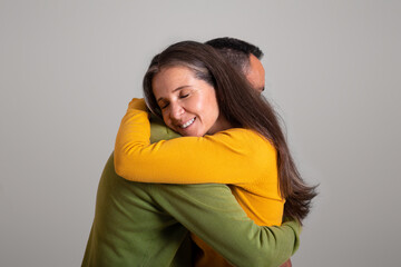 Happy glad european old man hugging woman, enjoy date together, help and support