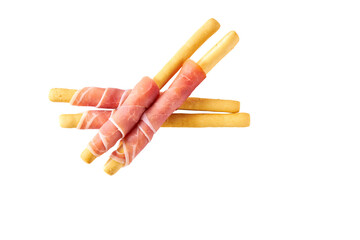 Italian grissini breadsticks with Parma ham prosciutto isolated on white background top view.