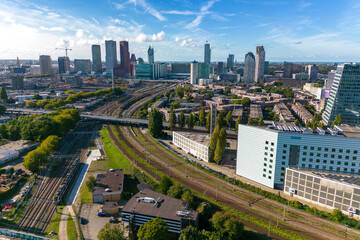 This aerial drone photo shows the city of the Hague, otherwise known as Den Haag in Zuid-Holland, the Netherlands. There are many skyscrapers and office buildings in this part and the railways. 