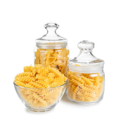 Fusilli and conchiglioni in glass jar isolated on white background. Two different types of raw pasta in glass jars, ingredient for cook, traditonal italian cuisine.