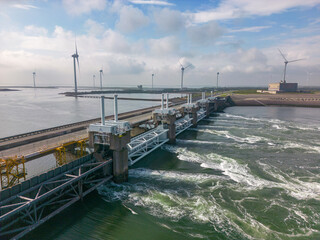 This aerial drone photo shows the Eastern Scheldt storm surge barrier in Zeeland, the Netherlands. This is also called the Oosterscheldekering near Neeltje-Jans and protects the land for high tide. 