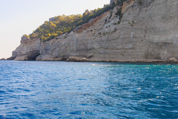 View of the rocky shore from the sea. Mediterranean Sea in Turkey. Popular tourist places. Background