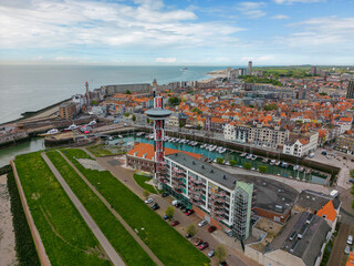 This aerial drone photo shows the Marina and harbour of Vlissingen. Vlissingen is a beautiful coastal town in Zeeland, the Netherlands. You can also see a part of the city center and Westerschelde. 