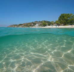 Fototapeta premium Atlantic coast beach with sand underwater in Spain, Galicia, split level view over and under water surface, Rias Baixas, Aldan, Cangas de Morrazo