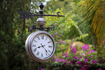 clock in the park in retro arabesque