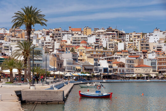 Sitia, Eastern Crete, Greece, Europe. 2023,  Waterfront of Sitia harbour in Eastern Crete with its small boats, hotels and restaurants on the seafront.