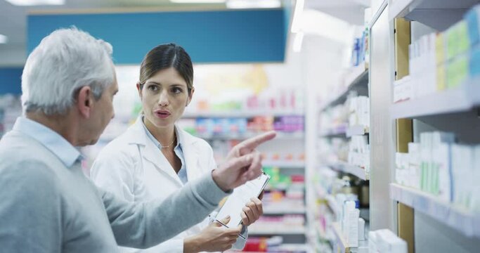 Pharmacy, shelf and woman with senior help, medicine support and customer service, happy healthcare and retail. Pharmacist, medical people or elderly patient talking, question and advice for pills