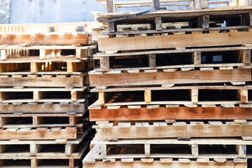 stack of wooden pallets in finished goods storage warehouse