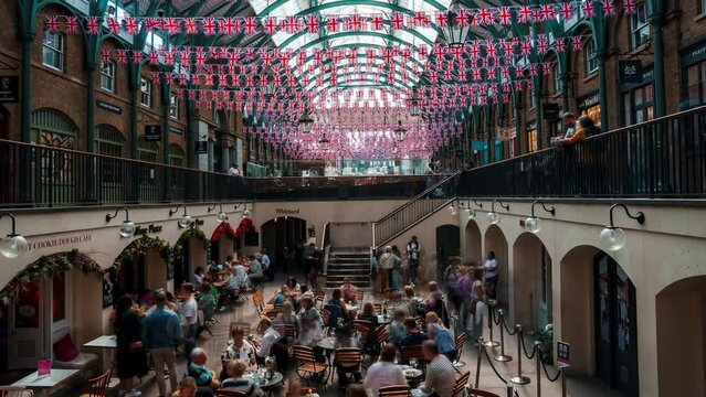 Summer in Covent Garden, one of the biggest flea market in UK. People rushing through the Covent Garden in London.