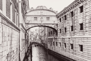 Venice retro photo . Bridge of Sighs over water canal in Venezia
