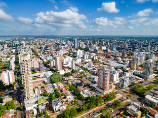 Fototapeta na wymiar Aerial view of the city Posadas in the interior of Argentina. Buildings, vegetation and urban life.