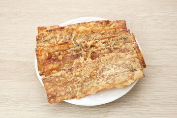 Sale Pisang Keju, made from bananas that are cut into thin strips, dried in the sun, then fried in flour. Indonesian traditional snack 
