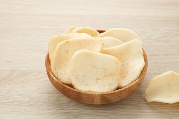 Kerupuk Udang, Crispy Prawn Crackers in wooden bowl 
