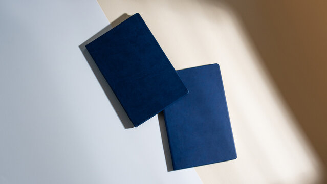 Mockup of dark blue business notepad in leather cover without logo. A5 diary