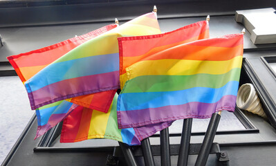 Pride rainbow lgbt gay flag being waved on wall background