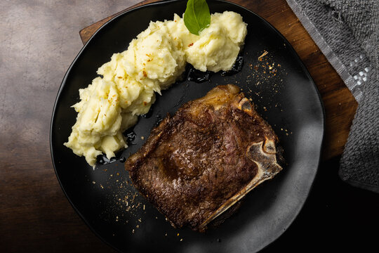 Savory Delights: Capturing the Temptation of Pork Ribs with Mashed Potatoes in a Mouthwatering Photograph