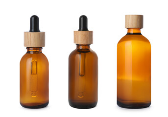 Set of different cosmetic oils in bottles on white background