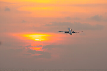 Fototapeta na wymiar Airplane will take off form airport,copy space sunset sky