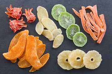 Colorful variety of crystallized candied fruits and plants (hibiscus, ginger, kiwi, papaya,...