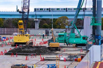 Cranes at the under construction near the railway telephoto shot