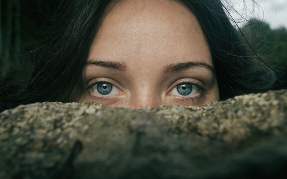 Woman covering half her face