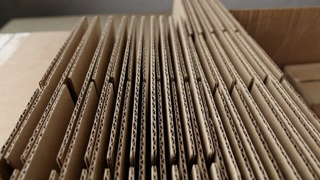 Cardboard boxes for packaging moving and shipping. Corrugated cardboard. Paper production. Industry. Manufacturing of packaging