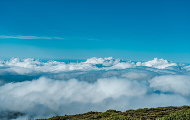 Sea of clouds at  Haleakala National Park, Maui, Hawaii. A sea of clouds is an overcast layer of clouds, as viewed from above, lengths resembling waves on the sea.
