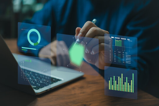 Business development and technology Data analyst for report marketing strategy planning. graph analysis and information on a futuristic virtual interface screen.