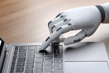Robot hand finger typing or pressing enter on computer keyboard. Cyborg mechanical arm working with...
