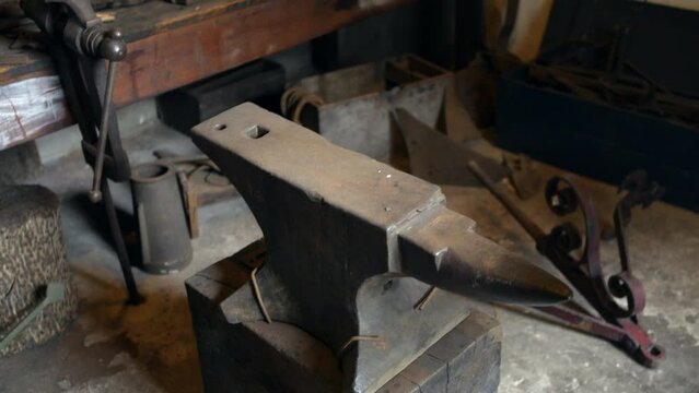 An iron anvil in a vintage saddlery ironmongers workshop