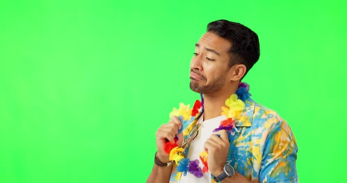 Happy, dancing and man in studio with green screen with a colorful hawaiian flower band. Happiness, smile and portrait of male person with crazy, comic and fun dance isolated by chromakey background.