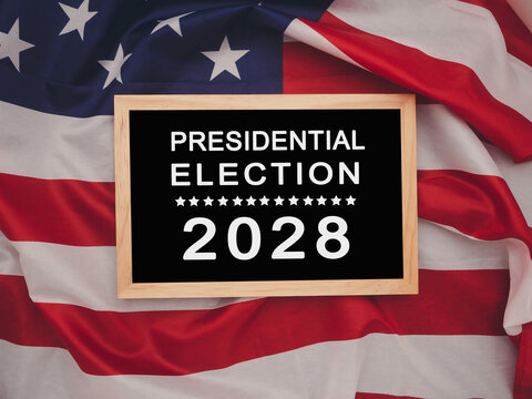 Presidential Election 2028 text on a mini chalkboard over the American Flag background