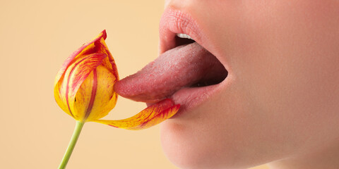 Licking lips. Woman mouth with sexy lips licking tongue flower. Mouth lick and suck close up....