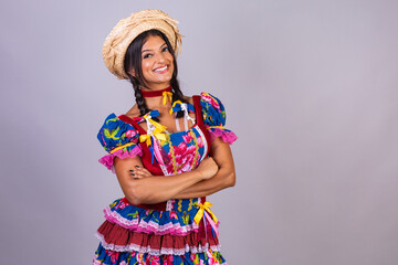 brazilian woman with clothes from festa de são joão, festa junina. horizontal photo, posing for...