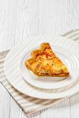 quiche with cheese and bacon filling on plate