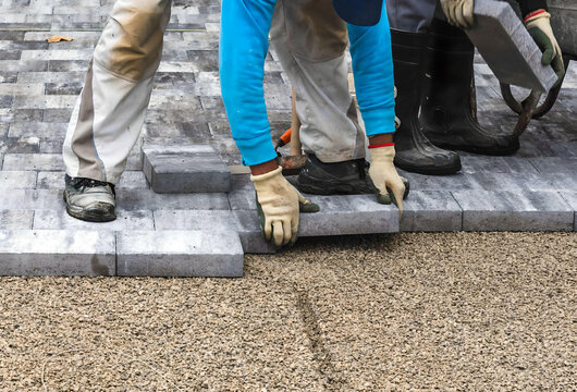  paving blocks. worker are installing paving blocks 