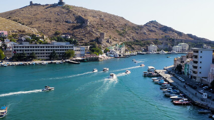 Sevastopol, Crimea - September 12, 2020: Balaklava Bay with yachts and pleasure boats, Aerial View