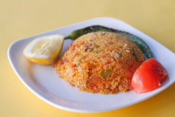 bulgur rice with tomato on a plate ,