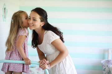 Morning idleness. Mom and daughter have fun.