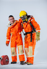 With utmost care and compassion the firefighter places his hands upper his partner's neck providing gentle support to ensure stability and safety during their work.