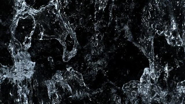Super Slow Motion Shot of Clear Water Wave Splash Isolated on Black Background at 1000fps.