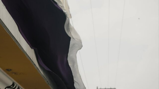 Purple Curtain Blown By The Wind During Semana Santa Holy Thursday In Antigua, Guatemala. Slow Motion