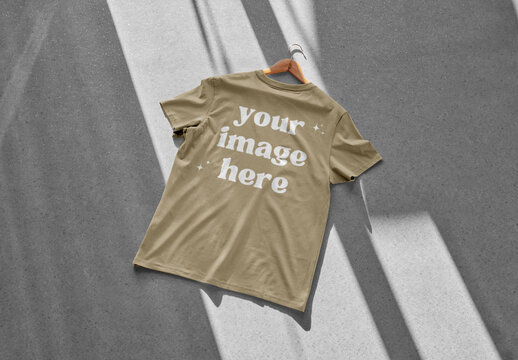 Mockup of customizable color t-shirt against customizable background, rear view