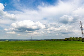 Fototapeta na wymiar Summer landscape, with fields and blue sky. European countryside.