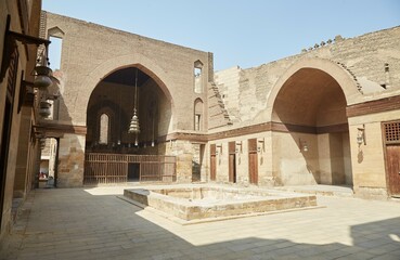 Fototapeta na wymiar The elaborate Qalawun Complex on Old Cairo's al-Muizz street