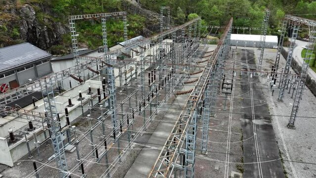 High voltage electric power distribution installation outside Eviny hydroelectric powerstation in Matre Norway - Aerial